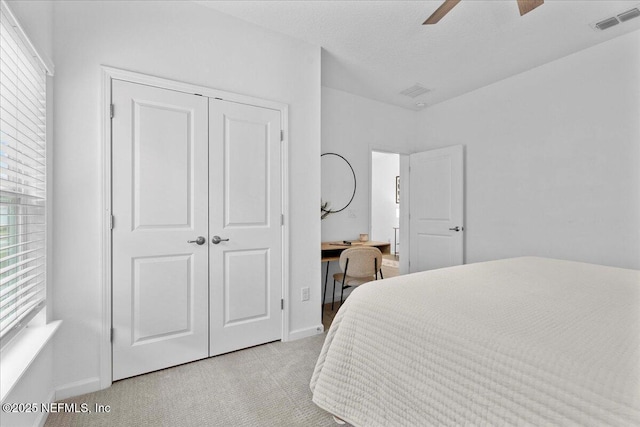 227 Wind Chime Ln, Saint Augustine, FL 32095 - bedroom featuring light colored carpet, a closet, a desk, and a ceiling fan