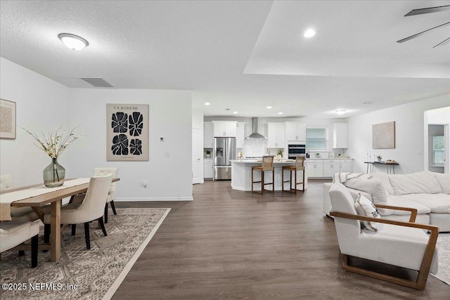 227 Wind Chime Ln, Saint Augustine, FL 32095 - living area with dark wood-style flooring, recessed lighting, and a textured ceiling