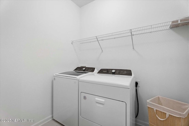 227 Wind Chime Ln, Saint Augustine, FL 32095 - washroom with washer and dryer and baseboards