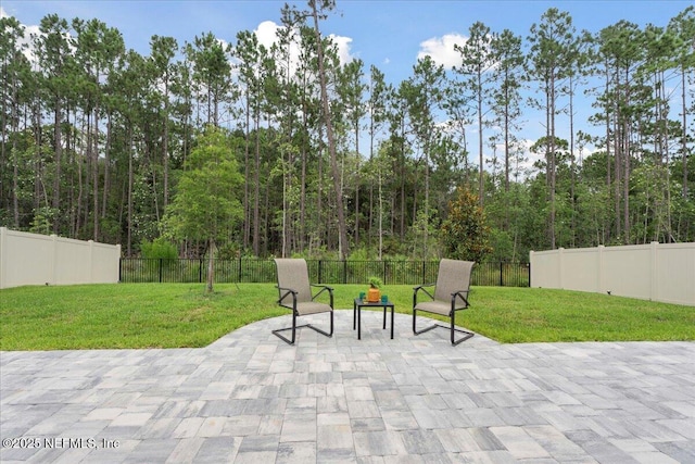 227 Wind Chime Ln, Saint Augustine, FL 32095 - fenced backyard with a patio