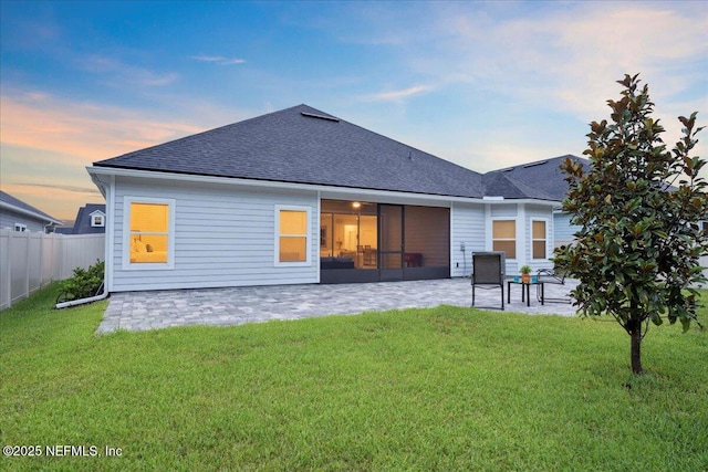 227 Wind Chime Ln, Saint Augustine, FL 32095 - rear view of house with a patio and a shingled roof