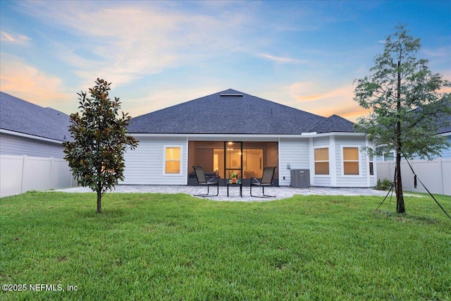 227 Wind Chime Ln, Saint Augustine, FL 32095 - rear view of property featuring a patio, a fenced backyard, and a shingled roof