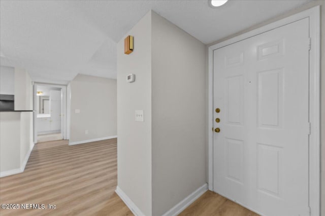 10200 Belle Rive Blvd Unit 79, Jacksonville, FL 32256 - foyer entrance with light wood finished floors and baseboards