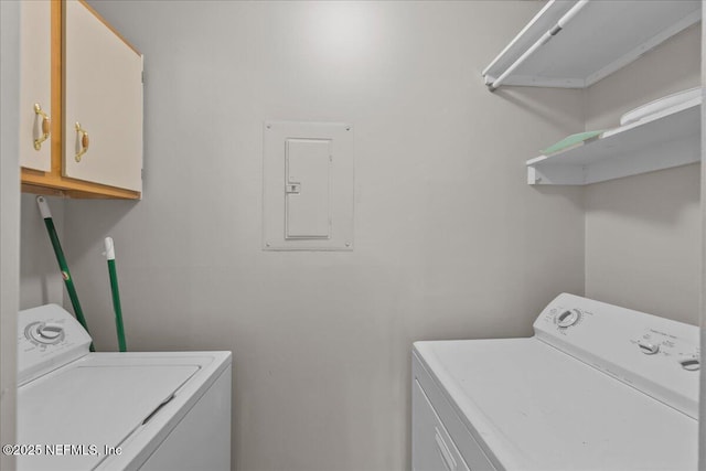 10200 Belle Rive Blvd Unit 79, Jacksonville, FL 32256 - washroom with electric panel, washing machine and clothes dryer, and cabinet space