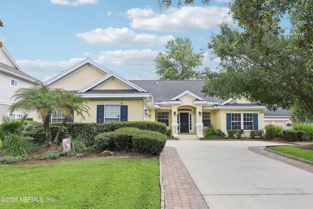 1028 Meadow View Ln, Saint Augustine, FL 32092 - ranch-style house with stucco siding, a front lawn, and concrete driveway