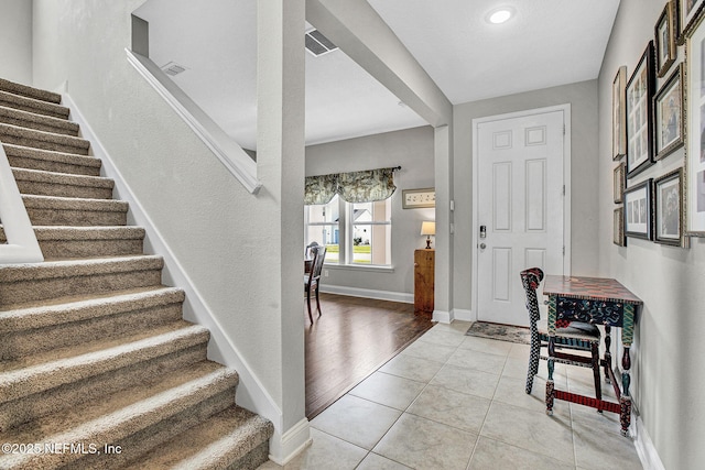 62 Seaside Vista Ct, Saint Augustine, FL 32084 - entryway with stairs, light tile patterned floors, and recessed lighting
