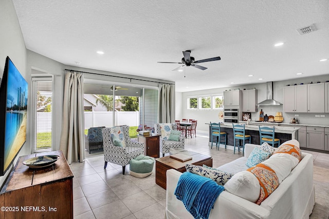 62 Seaside Vista Ct, Saint Augustine, FL 32084 - living area featuring ceiling fan, recessed lighting, light tile patterned floors, and a textured ceiling