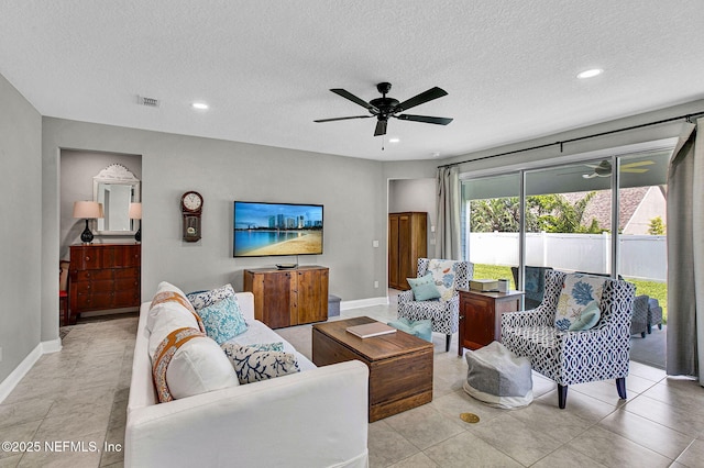 62 Seaside Vista Ct, Saint Augustine, FL 32084 - living room featuring a ceiling fan, a textured ceiling, and recessed lighting