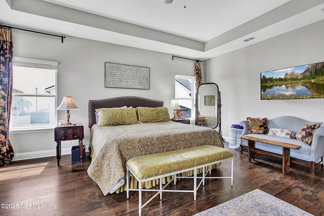 62 Seaside Vista Ct, Saint Augustine, FL 32084 - bedroom featuring a tray ceiling, wood finished floors, and ceiling fan