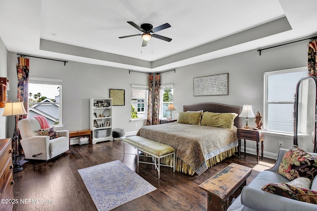 62 Seaside Vista Ct, Saint Augustine, FL 32084 - bedroom featuring a raised ceiling, wood finished floors, and ceiling fan