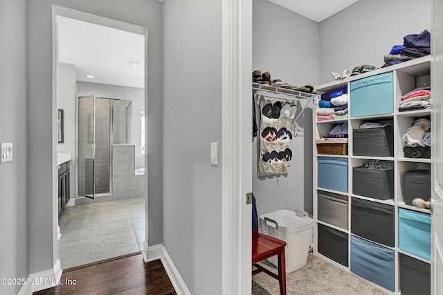 62 Seaside Vista Ct, Saint Augustine, FL 32084 - walk in closet featuring wood finished floors