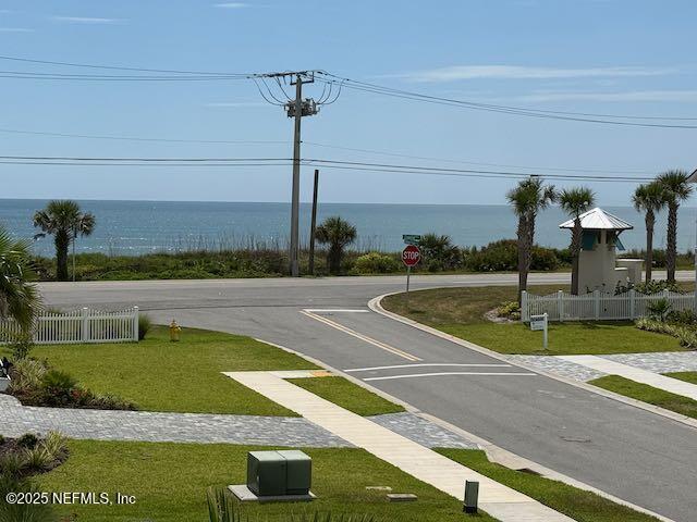 62 Seaside Vista Ct, Saint Augustine, FL 32084 - view of asphalt road featuring traffic signs and a water view