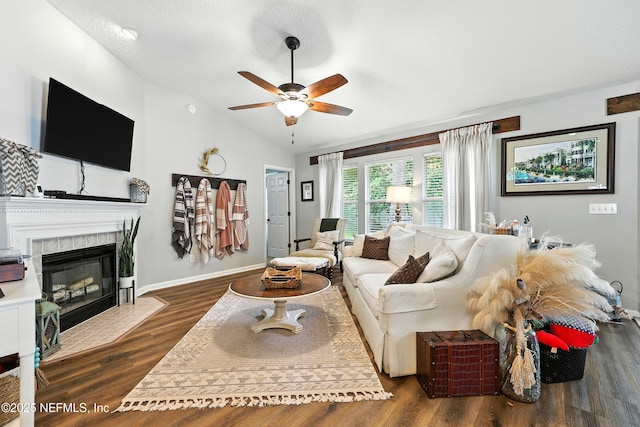 145 E Blackjack Branch Way, Saint Johns, FL 32259 - living area featuring a ceiling fan, a tiled fireplace, vaulted ceiling, and wood finished floors