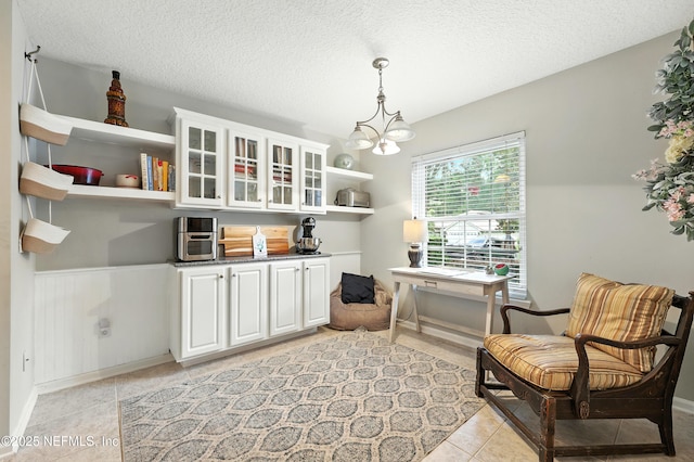 145 E Blackjack Branch Way, Saint Johns, FL 32259 - sitting room with light tile patterned flooring, a textured ceiling, and a chandelier