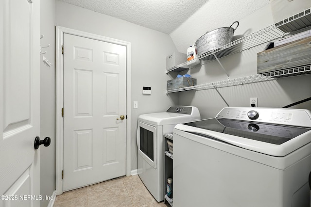 145 E Blackjack Branch Way, Saint Johns, FL 32259 - washroom featuring washer and dryer, light tile patterned floors, and a textured ceiling