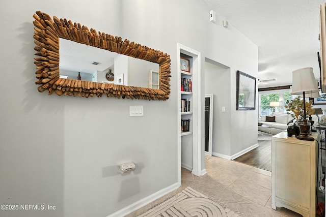145 E Blackjack Branch Way, Saint Johns, FL 32259 - hall featuring light tile patterned floors and a textured ceiling