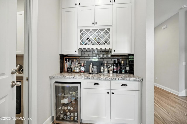214 Gap Creek Dr, Saint Johns, FL 32259 - indoor dry bar with beverage cooler, tasteful backsplash, and light wood-style flooring