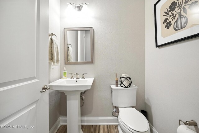 214 Gap Creek Dr, Saint Johns, FL 32259 - half bathroom featuring toilet and wood finished floors