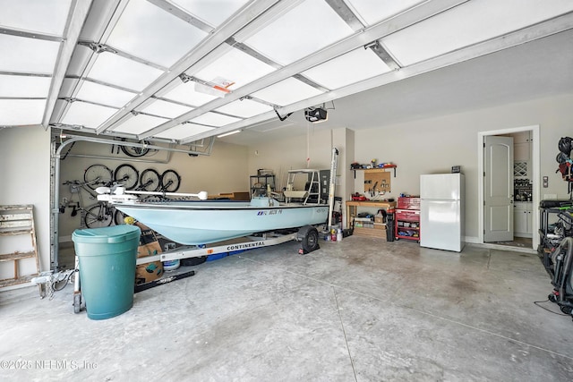 214 Gap Creek Dr, Saint Johns, FL 32259 - garage featuring freestanding refrigerator and a garage door opener
