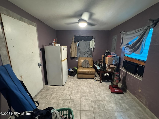 511 Clearview Dr, Cocoa, FL 32927 - recreation room featuring a ceiling fan, tile patterned floors, and electric panel
