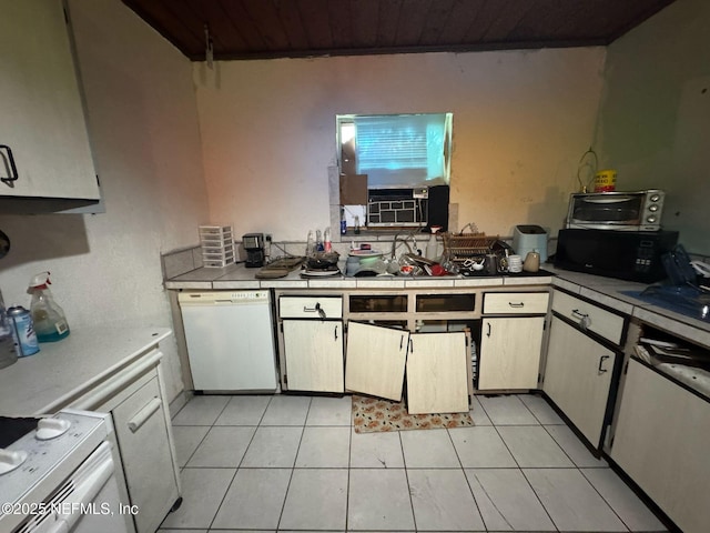 511 Clearview Dr, Cocoa, FL 32927 - kitchen featuring dishwasher, wood ceiling, light tile patterned floors, tile counters, and range