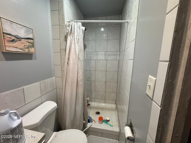 511 Clearview Dr, Cocoa, FL 32927 - full bathroom featuring a stall shower and tile walls