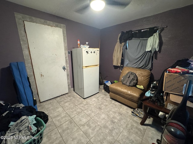 511 Clearview Dr, Cocoa, FL 32927 - misc room with a ceiling fan, light tile patterned floors, and a textured ceiling