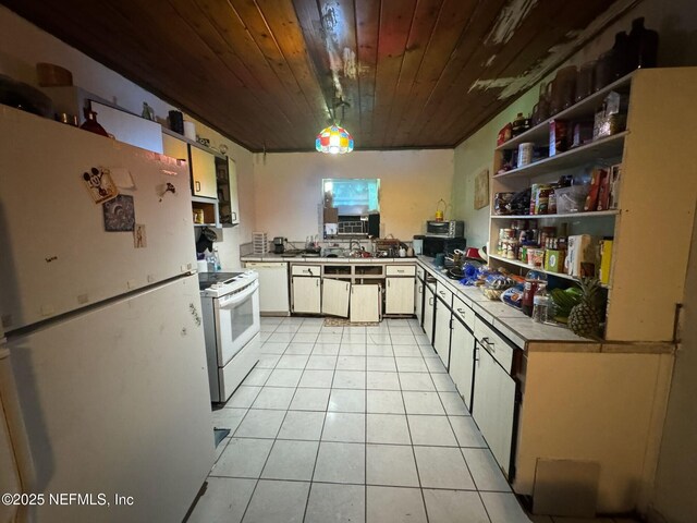 511 Clearview Dr, Cocoa, FL 32927 - kitchen featuring white appliances, light tile patterned flooring, wood ceiling, open shelves, and light countertops