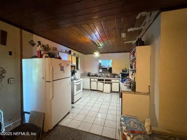 511 Clearview Dr, Cocoa, FL 32927 - kitchen featuring white appliances, wooden ceiling, light tile patterned floors, white cabinetry, and pendant lighting