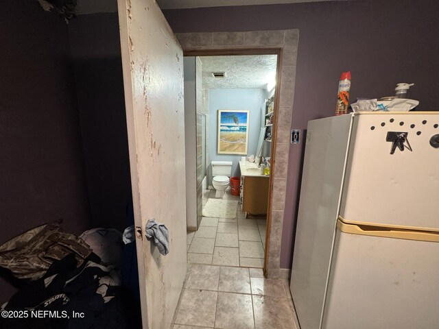 511 Clearview Dr, Cocoa, FL 32927 - hallway featuring light tile patterned floors