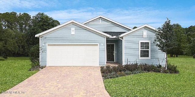 2692 Field Daisy Ln, Green Cove Springs, FL 32043 - ranch-style home featuring a garage, a front lawn, and decorative driveway
