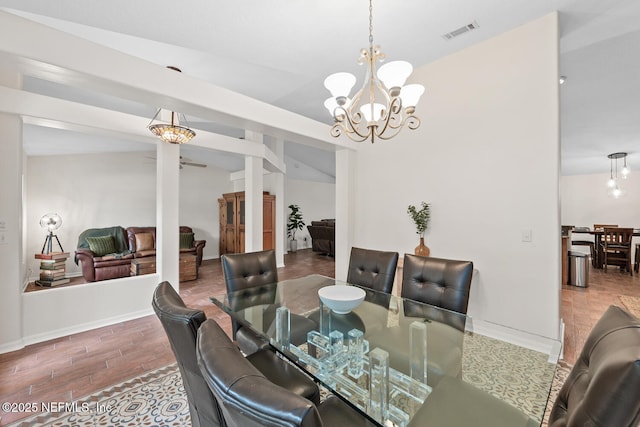 213 Seamist Ct, Ponte Vedra Beach, FL 32082 - dining space featuring vaulted ceiling, a chandelier, and wood finished floors