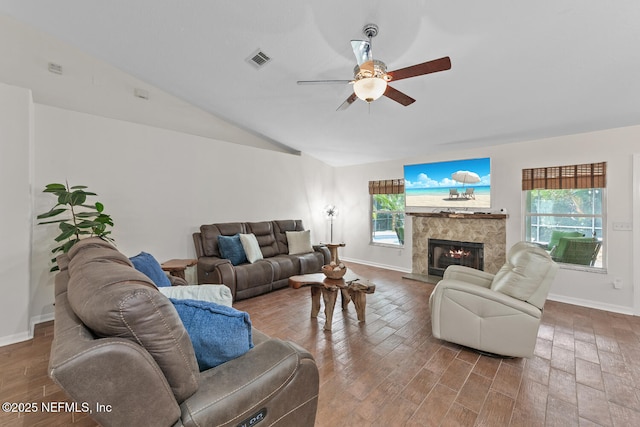 213 Seamist Ct, Ponte Vedra Beach, FL 32082 - living room featuring ceiling fan, vaulted ceiling, a glass covered fireplace, and wood finished floors