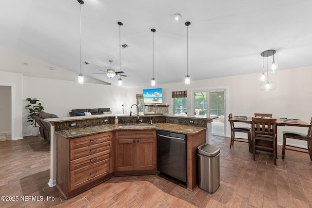 213 Seamist Ct, Ponte Vedra Beach, FL 32082 - kitchen with dishwasher, open floor plan, wood finished floors, lofted ceiling, and brown cabinets