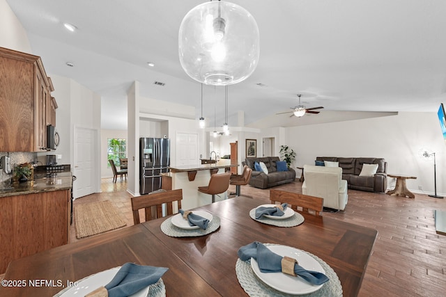 213 Seamist Ct, Ponte Vedra Beach, FL 32082 - dining area with vaulted ceiling, light wood finished floors, and a ceiling fan