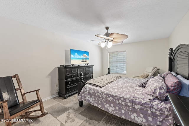 213 Seamist Ct, Ponte Vedra Beach, FL 32082 - bedroom featuring stone tile floors, ceiling fan, and a textured ceiling