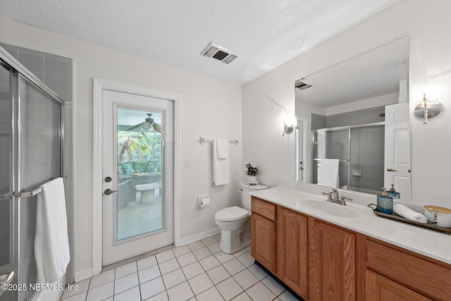213 Seamist Ct, Ponte Vedra Beach, FL 32082 - bathroom featuring tile patterned floors, vanity, a textured ceiling, and a shower with shower door