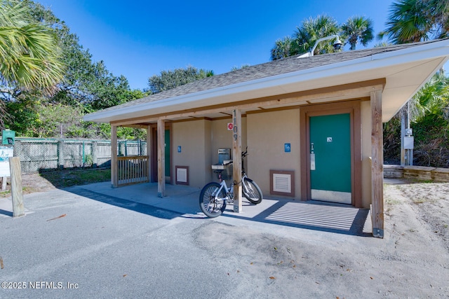 213 Seamist Ct, Ponte Vedra Beach, FL 32082 - property entrance featuring stucco siding and a shingled roof