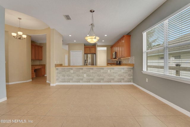 25122 Chipshot Ct, Sorrento, FL 32776 - kitchen featuring stainless steel appliances, light tile patterned flooring, decorative backsplash, a chandelier, and recessed lighting