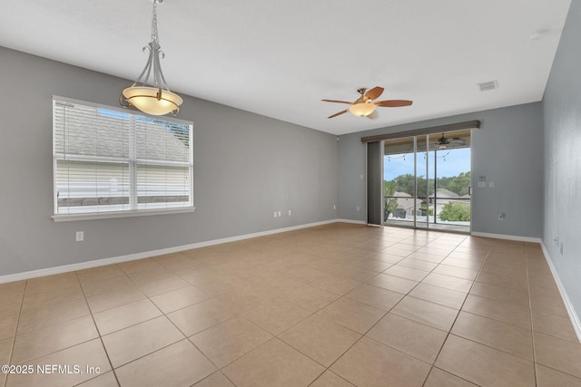 25122 Chipshot Ct, Sorrento, FL 32776 - spare room featuring a ceiling fan, light tile patterned floors, and a smoke detector