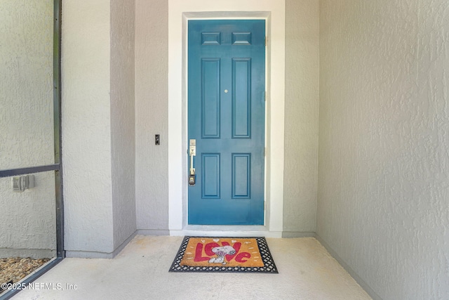 25122 Chipshot Ct, Sorrento, FL 32776 - doorway to property featuring stucco siding