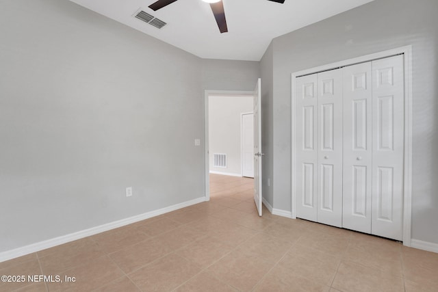 25122 Chipshot Ct, Sorrento, FL 32776 - unfurnished bedroom with light tile patterned flooring, a closet, and a ceiling fan