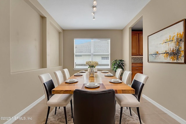 25122 Chipshot Ct, Sorrento, FL 32776 - dining space with light tile patterned floors and track lighting