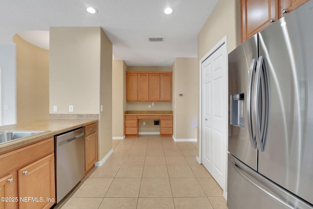 25122 Chipshot Ct, Sorrento, FL 32776 - kitchen featuring appliances with stainless steel finishes, light tile patterned floors, light countertops, and recessed lighting