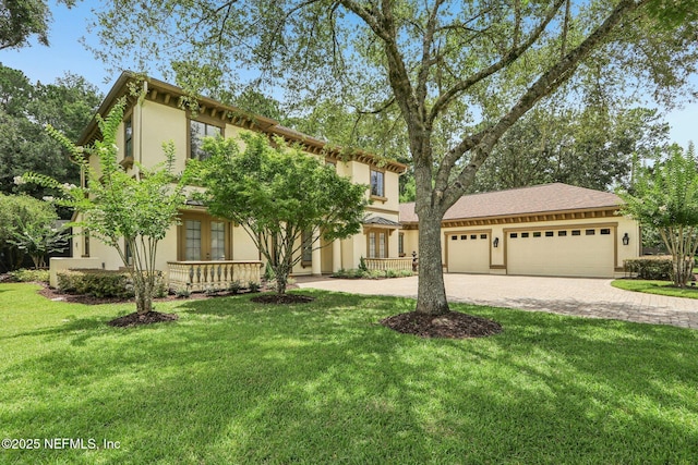 2645 Oakgrove Ave, Saint Augustine, FL 32092 - view of front of house featuring stucco siding, french doors, driveway, and a front lawn