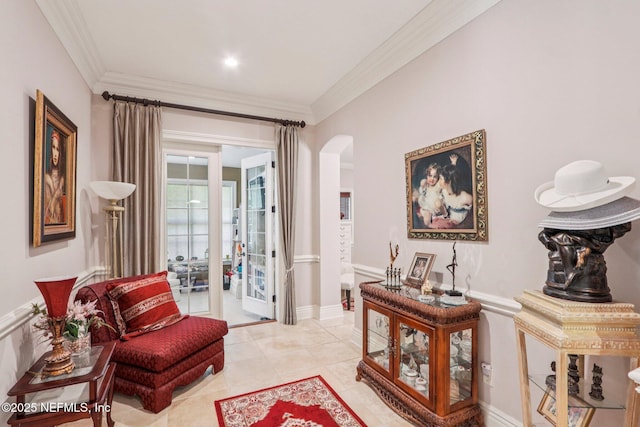 2645 Oakgrove Ave, Saint Augustine, FL 32092 - living area featuring arched walkways, crown molding, french doors, and light tile patterned flooring