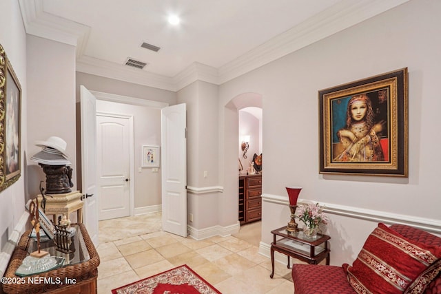 2645 Oakgrove Ave, Saint Augustine, FL 32092 - sitting room with arched walkways, crown molding, and light tile patterned floors