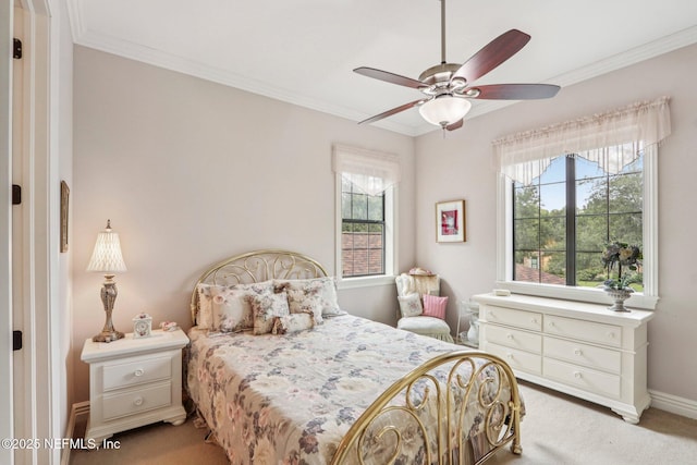 2645 Oakgrove Ave, Saint Augustine, FL 32092 - carpeted bedroom featuring multiple windows, ornamental molding, and a ceiling fan