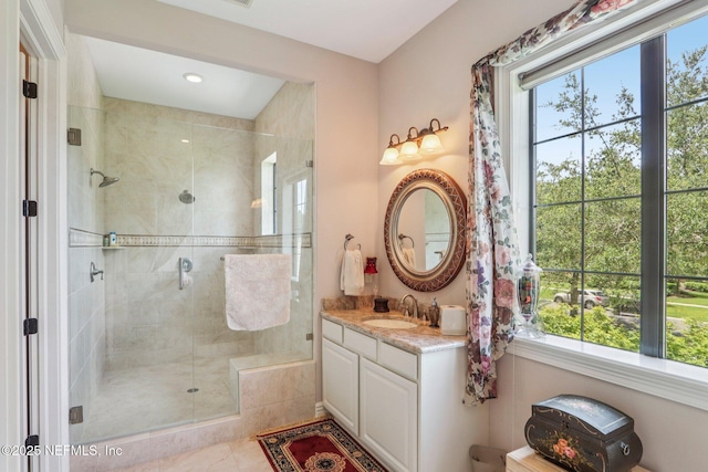 2645 Oakgrove Ave, Saint Augustine, FL 32092 - full bath featuring healthy amount of natural light, vanity, a shower stall, tile patterned floors, and recessed lighting