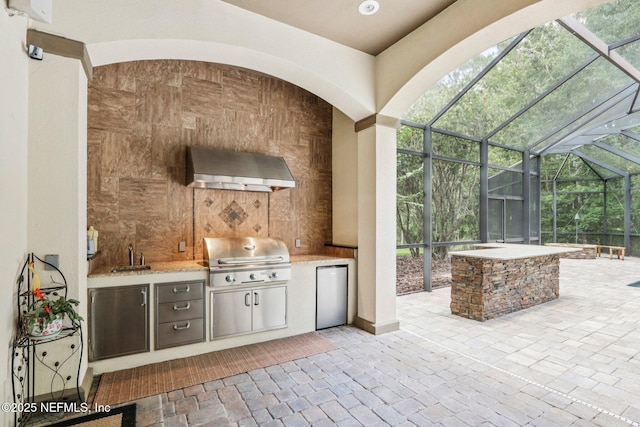 2645 Oakgrove Ave, Saint Augustine, FL 32092 - view of patio / terrace featuring exterior kitchen and a lanai